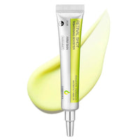 Retinol shot skincare booster with a smear of yellow cream on a white background